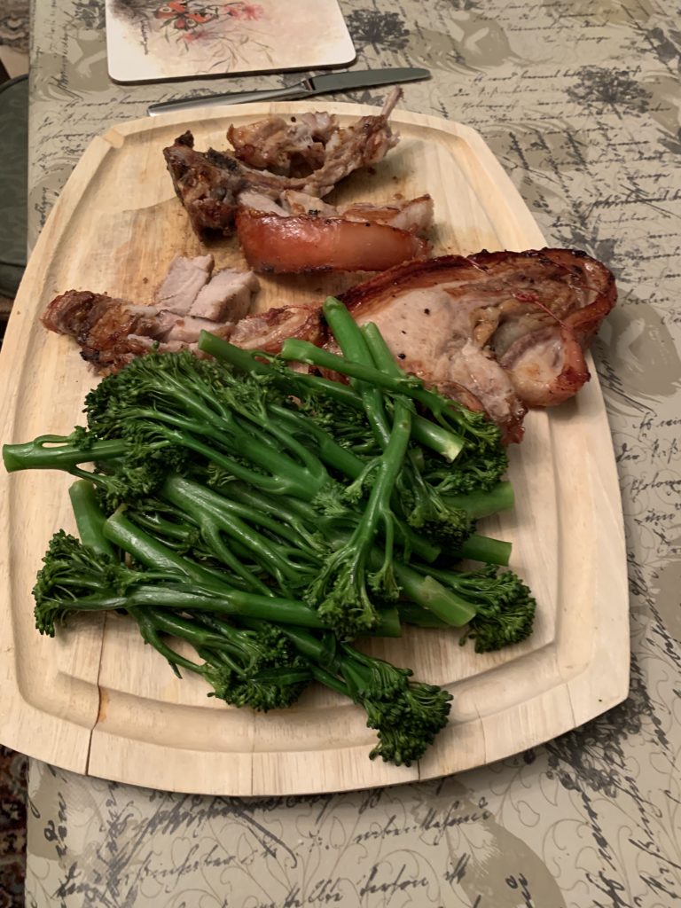 Grilled pork chop with sautéed spinach