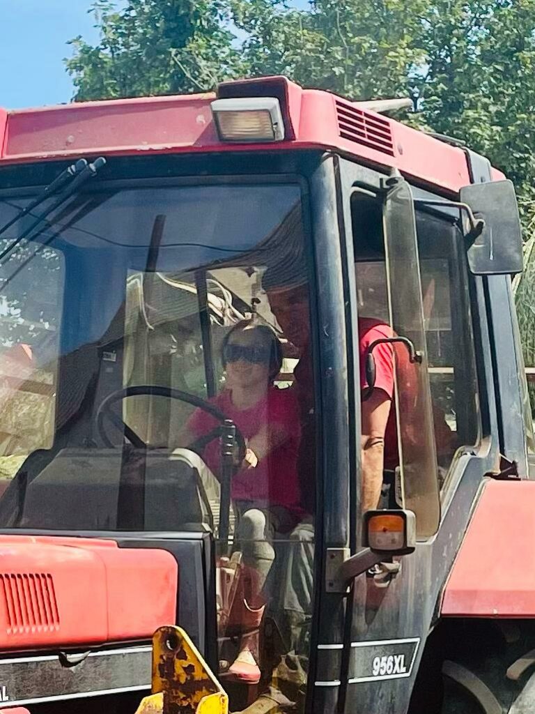 Alice driving the tractor